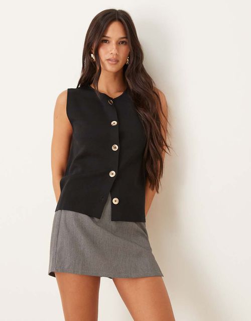 Knitted high neck vest with gold buttons in black