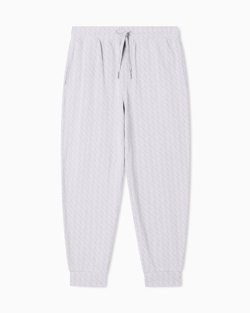 Jogger pants with all-over logo print