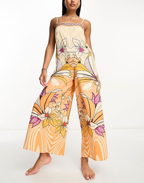 Wide leg beach jumpsuit in orange tropical print