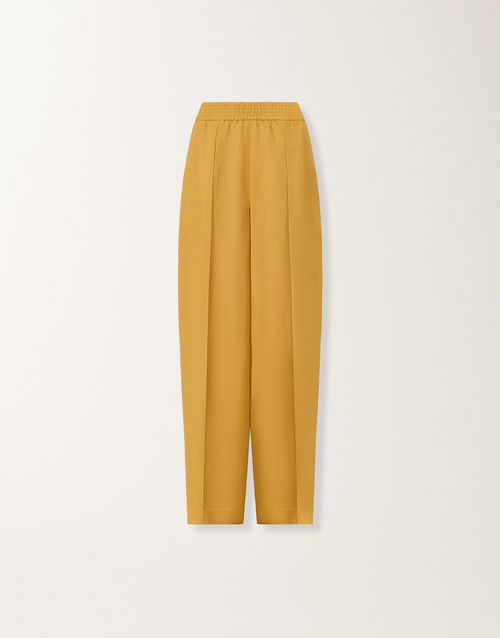 Fluid linen and viscose trousers in mustard