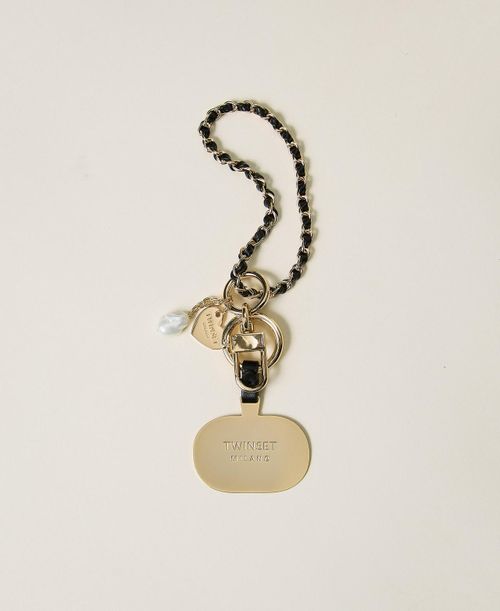 Cell phone holder with logo plate