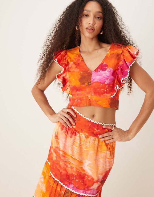 Ruffle sleeve tie back cropped top in orange print - part of a set