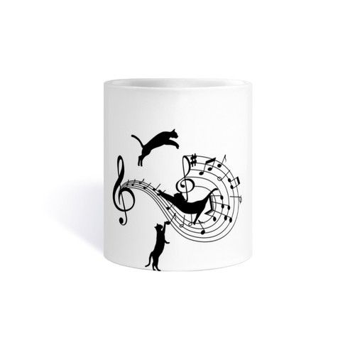 Cats play on musical notes