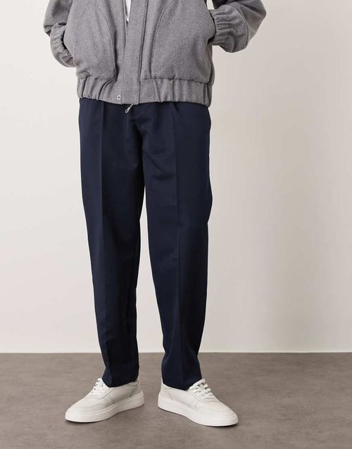 Smart oversized tapered trousers with front pleats in navy