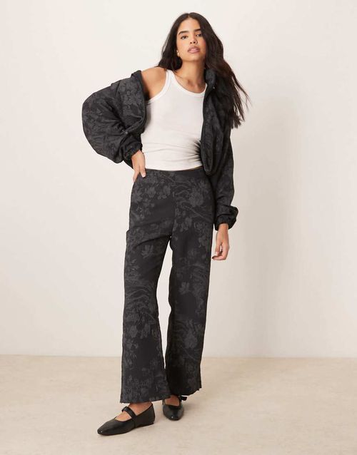 Flared jacquard print pants in black