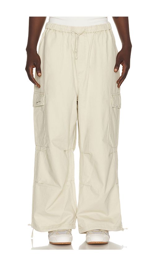 DRMERS CLUB Smiley Logo Parachute Pants in Light Beige. XL/1X also in S