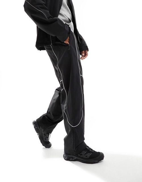 Tek piping wind pants in black