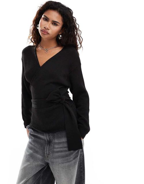 Wrap front sweater in black knit