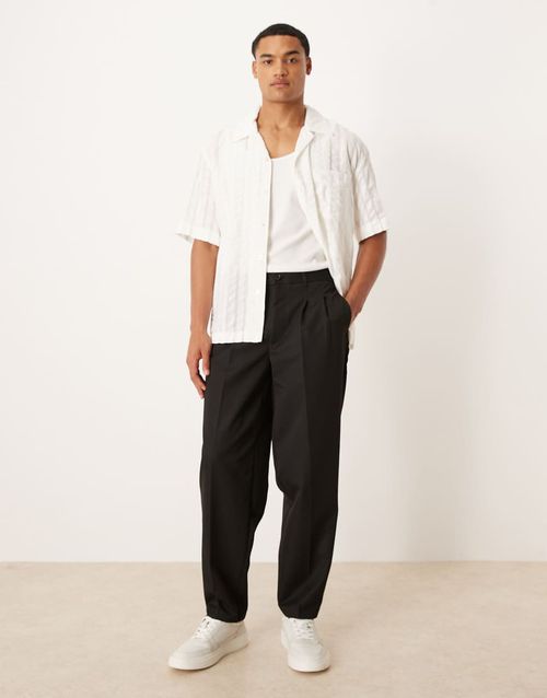 Oversized tapered pants with double pleat in black