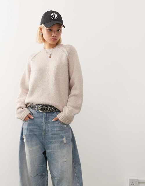 Oversized jumper in slub yarn with reversed seams in off-white