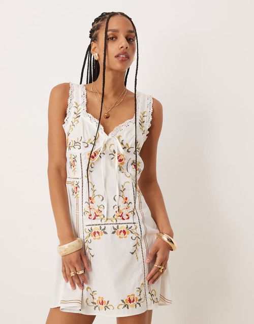 Embroidered mini dress with tie bust in white