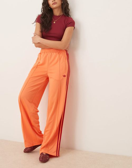 Adidas Originals Adicolor Firebird oversized track pant in orange-pink