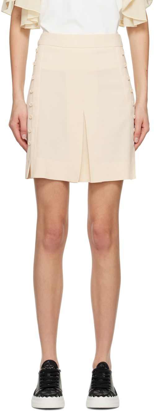 Beige button mini skirt