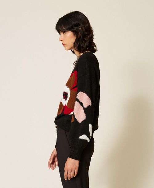 Jumper with inlaid flower