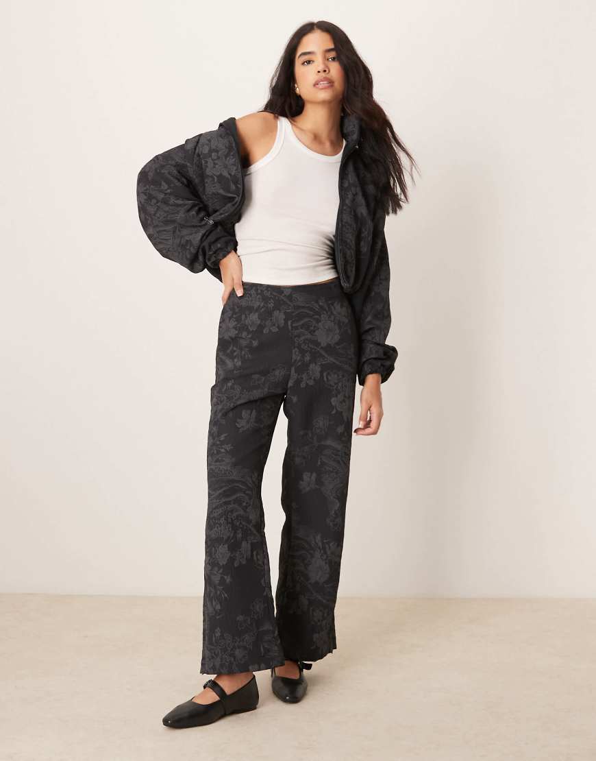 Flared jacquard print pants in black