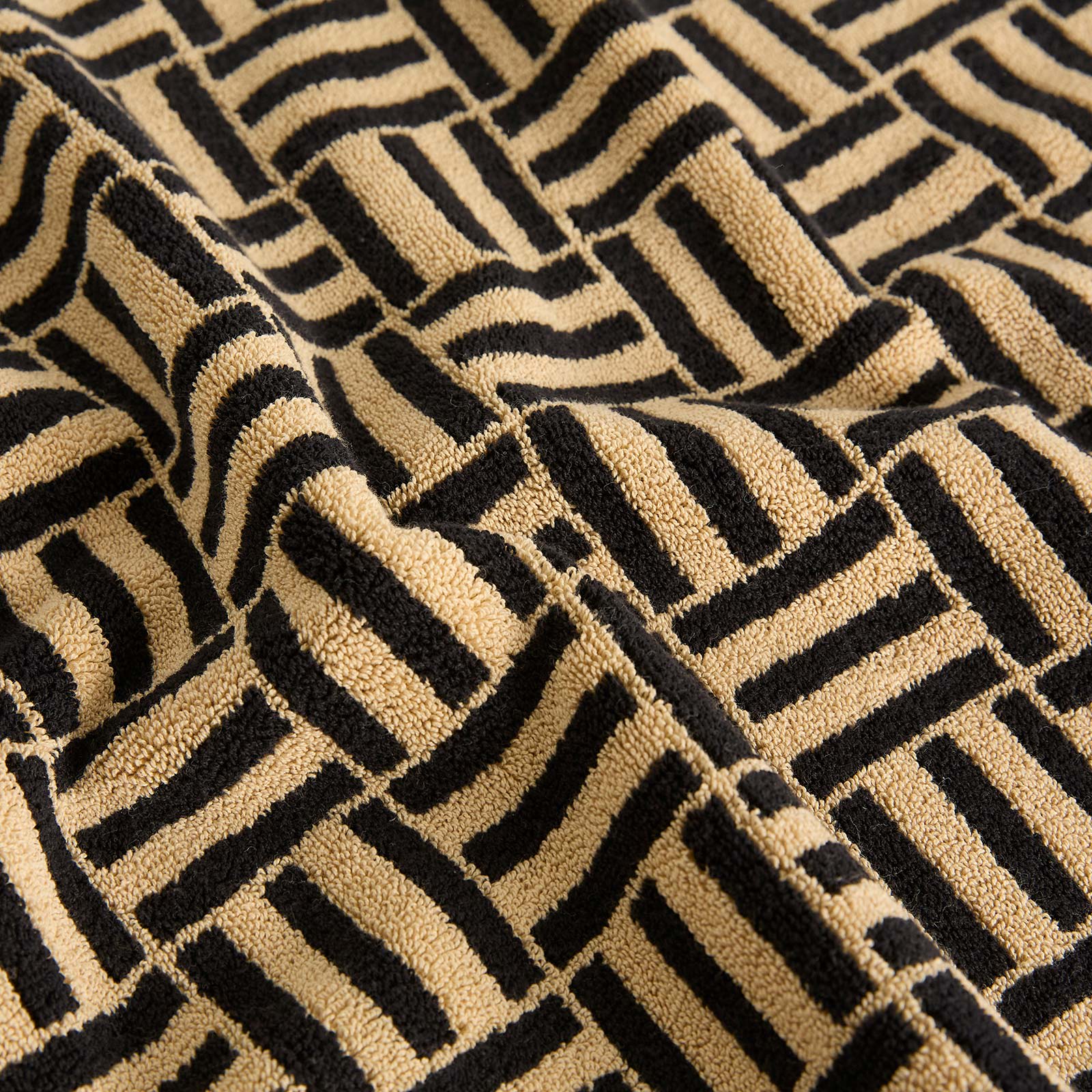 BAINA Saroma Bath Mat in Sand & Noir - Black.  a
