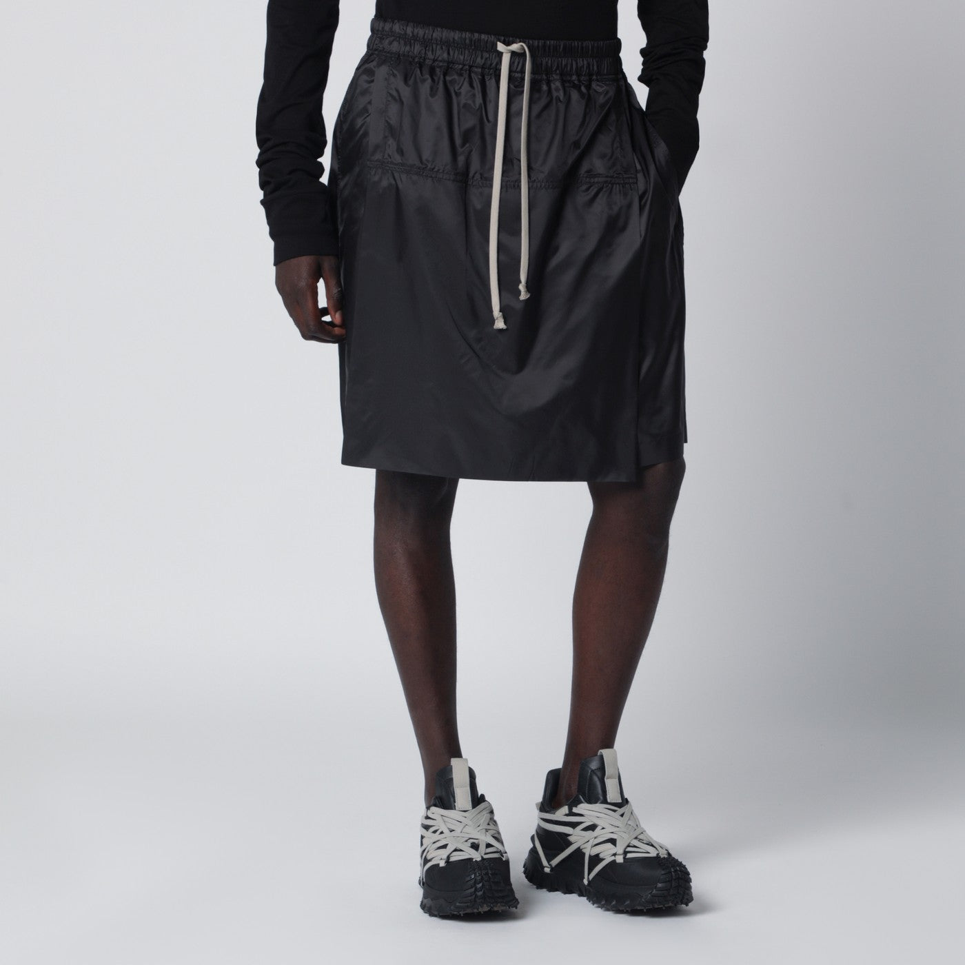 Black drawstring kilt shorts