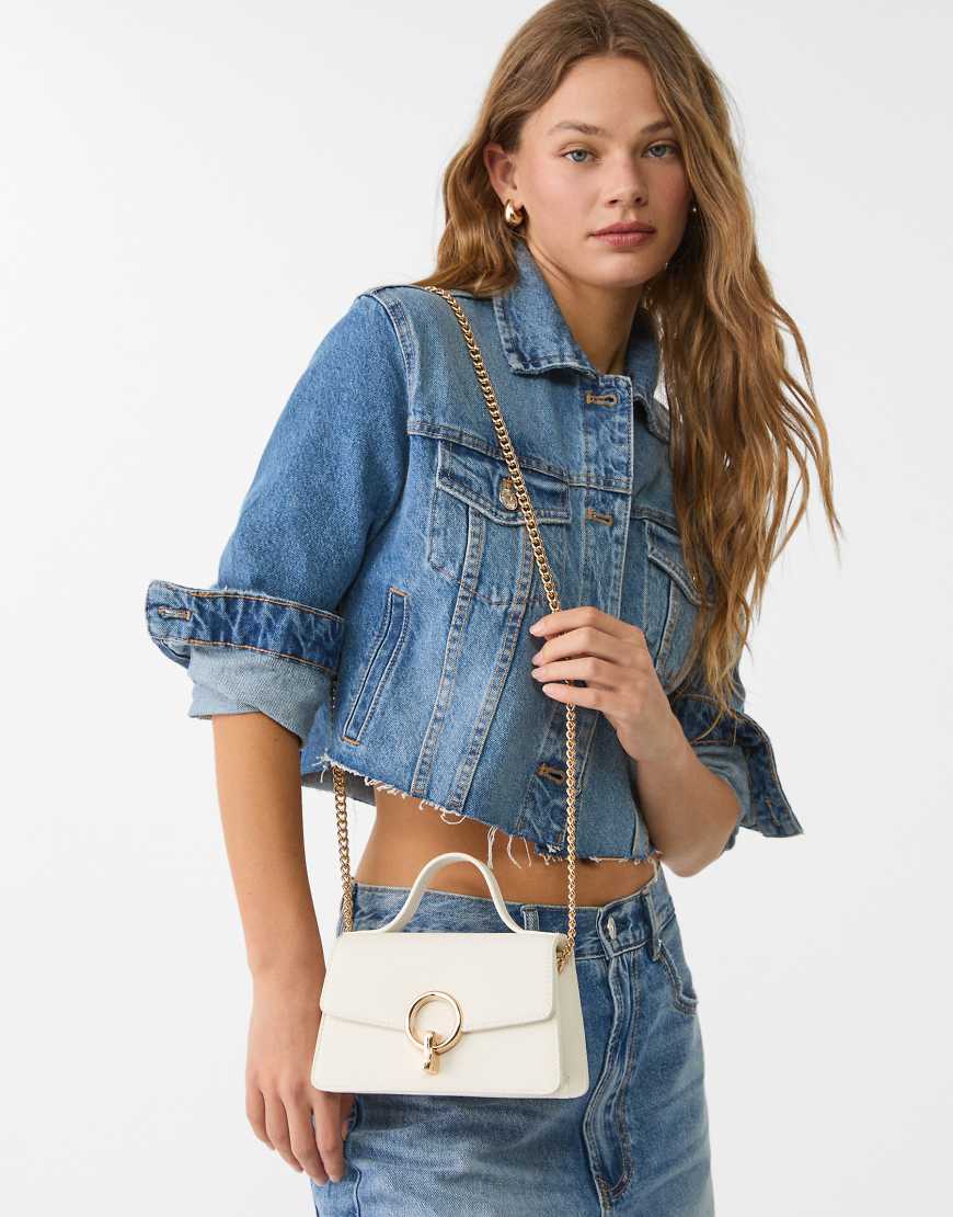 Crossbody bag with round clasp in white