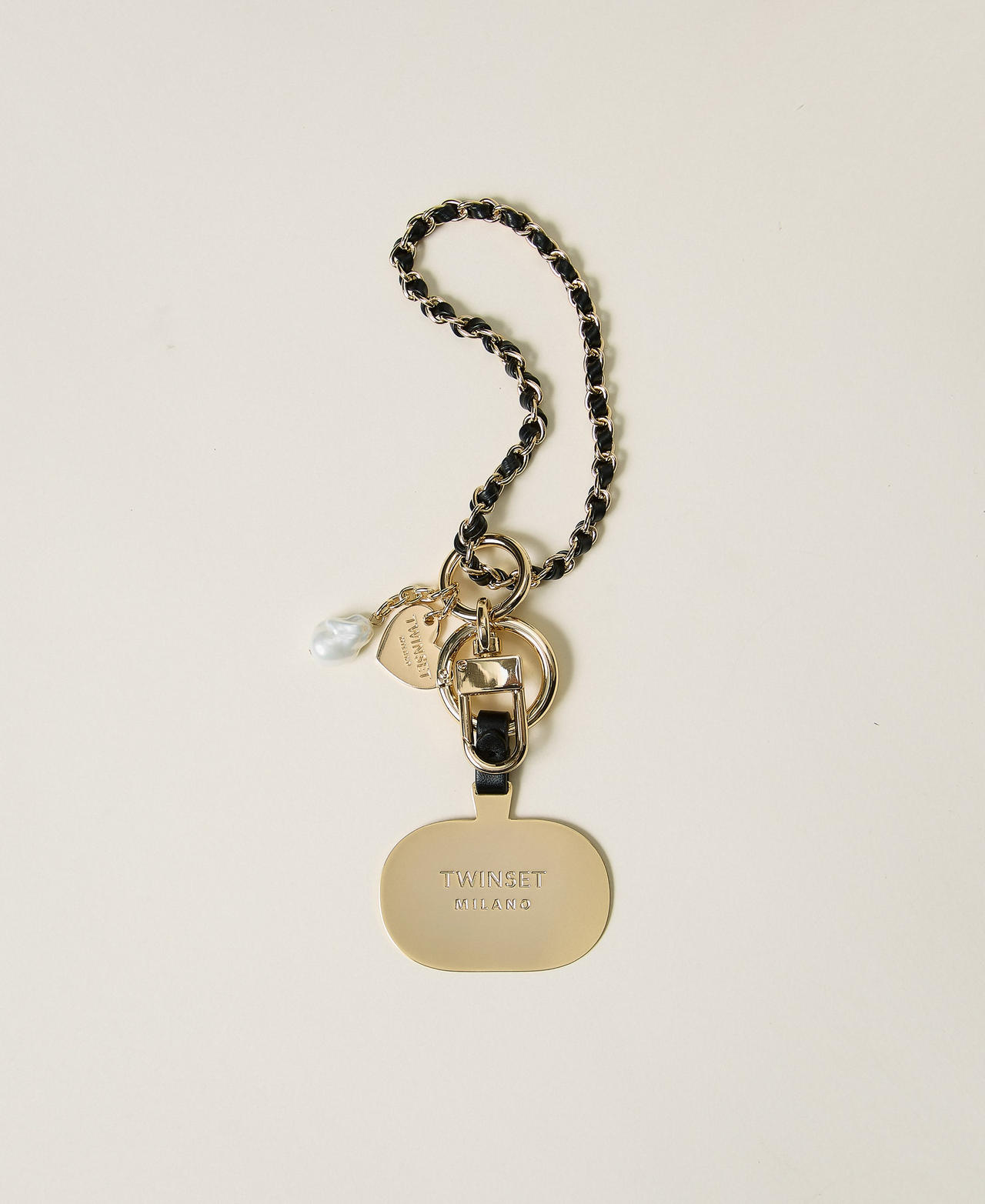 Cell phone holder with logo plate