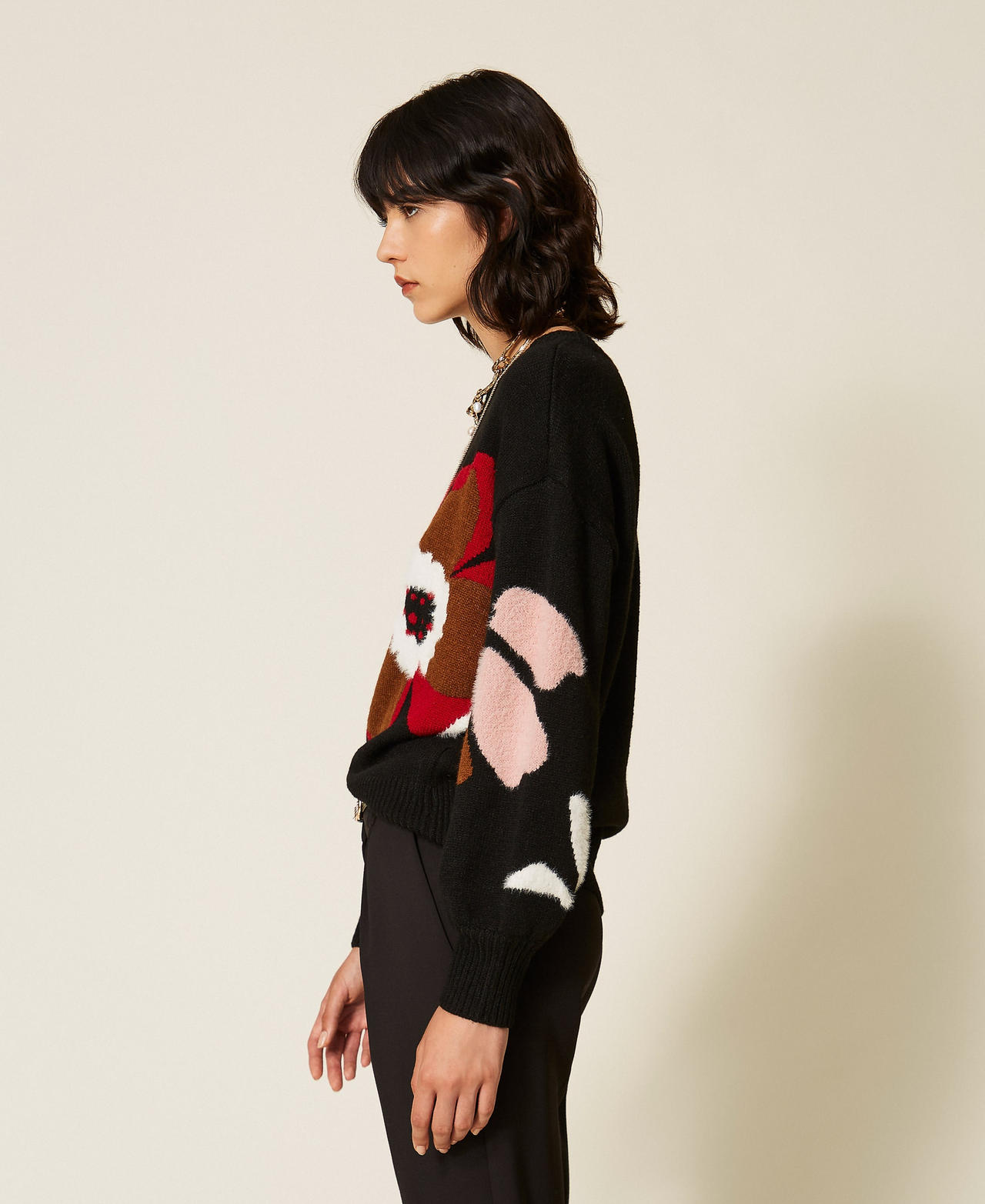 Jumper with inlaid flower