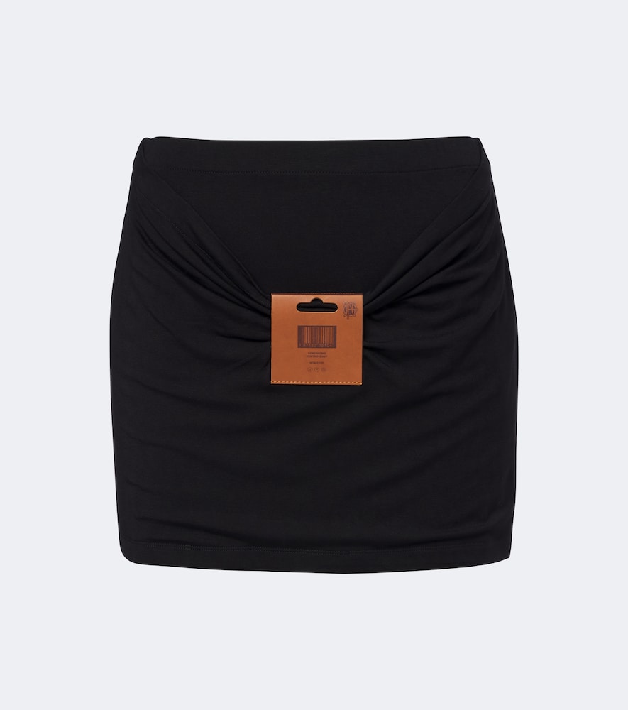 Leather-trimmed jersey miniskirt