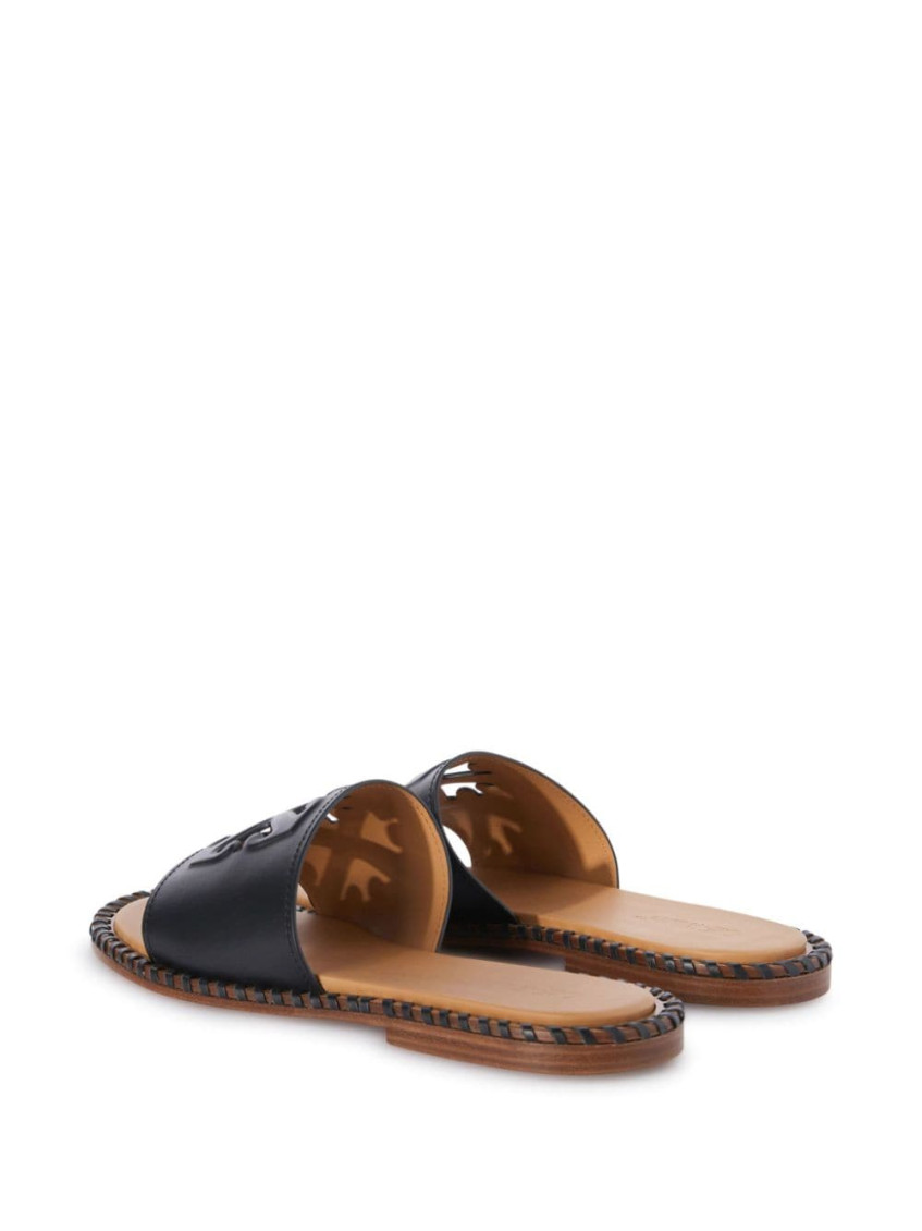 Twist Arrow-embossed leather slides - Black