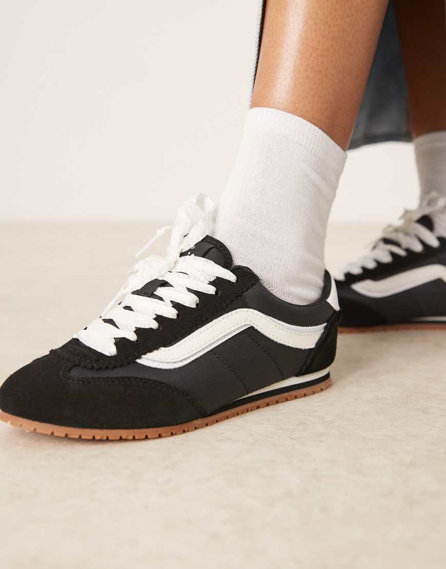 Super Lowpro trainers in black and white with lace detailing