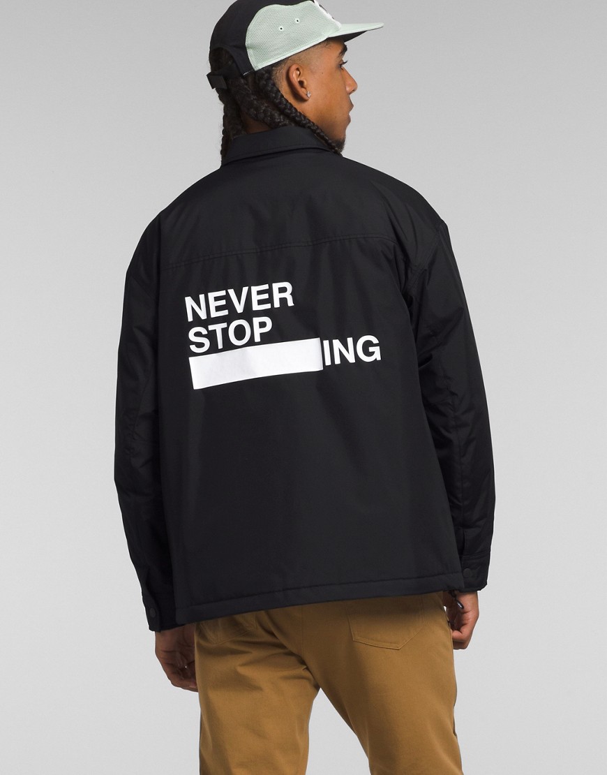 Back print coach jacket in black
