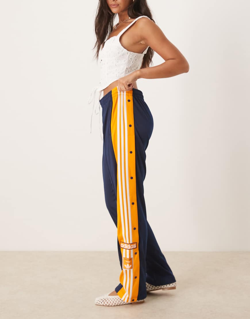 Adibreak track pants in navy and orange