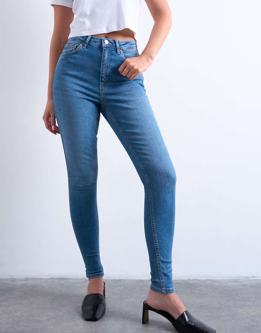 Jamie high rise skinny jean in mid blue