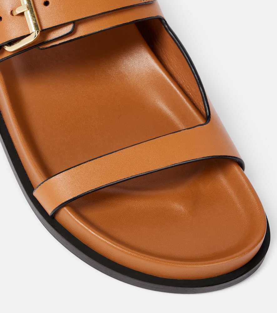A. Emery Prince leather slides