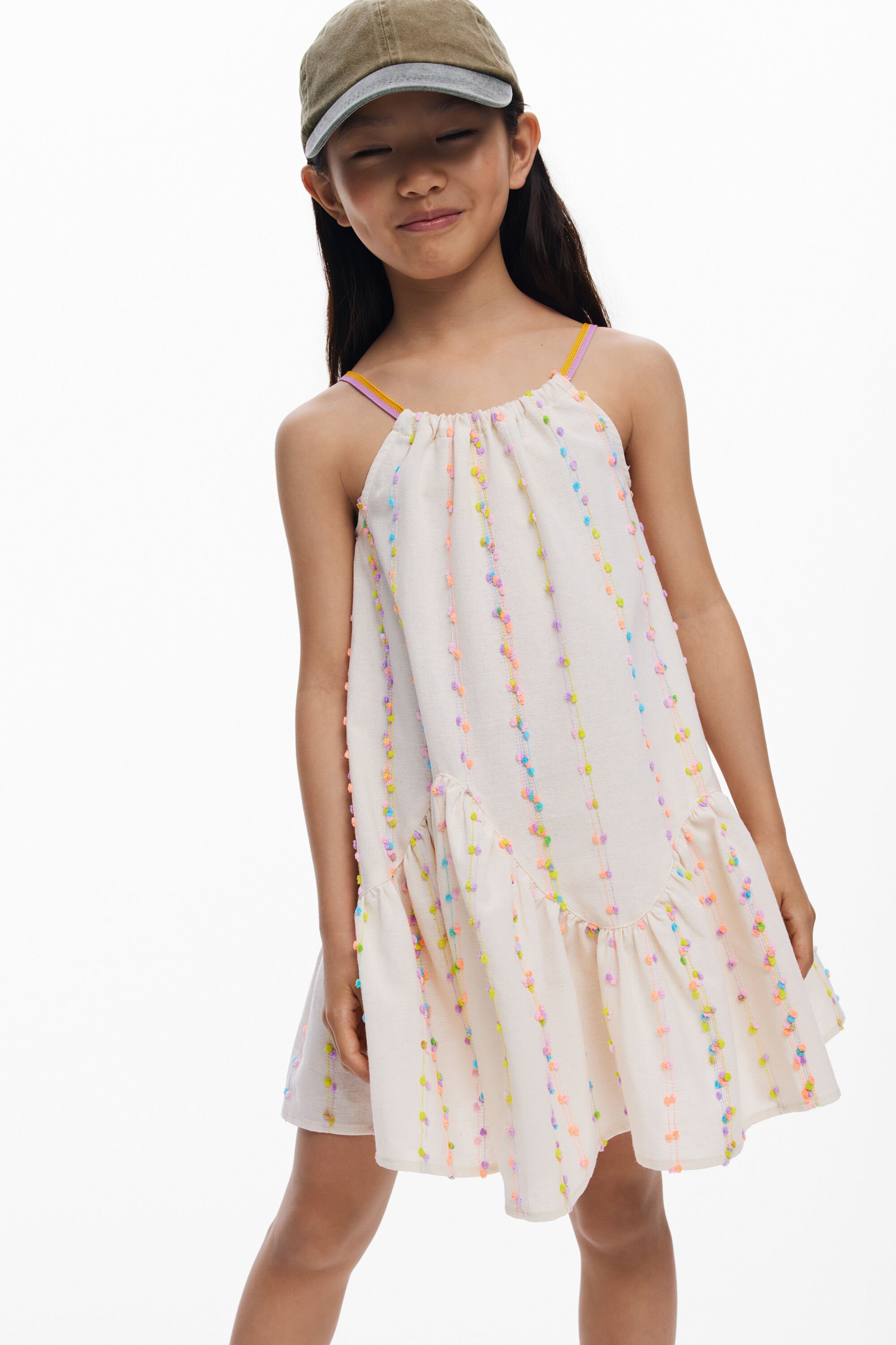 Dress with straps and pompo