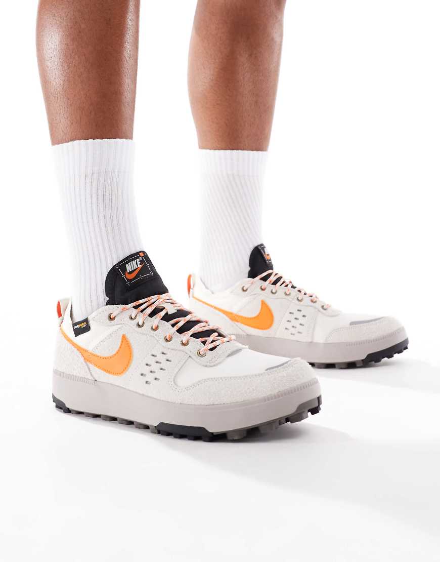 Nike C1TY sneakers in off-white and orange