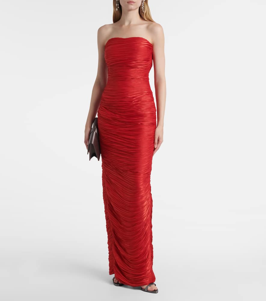 Caped pleated bustier gown
