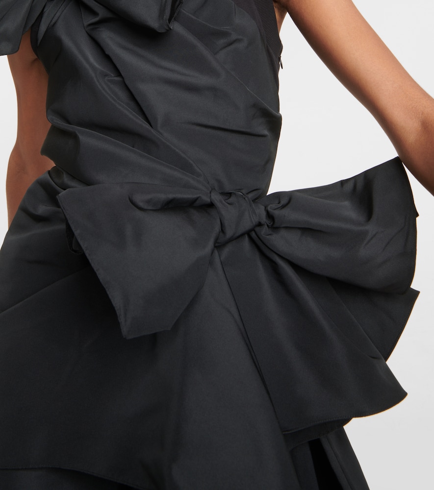 Asymmetric bow-detail top
