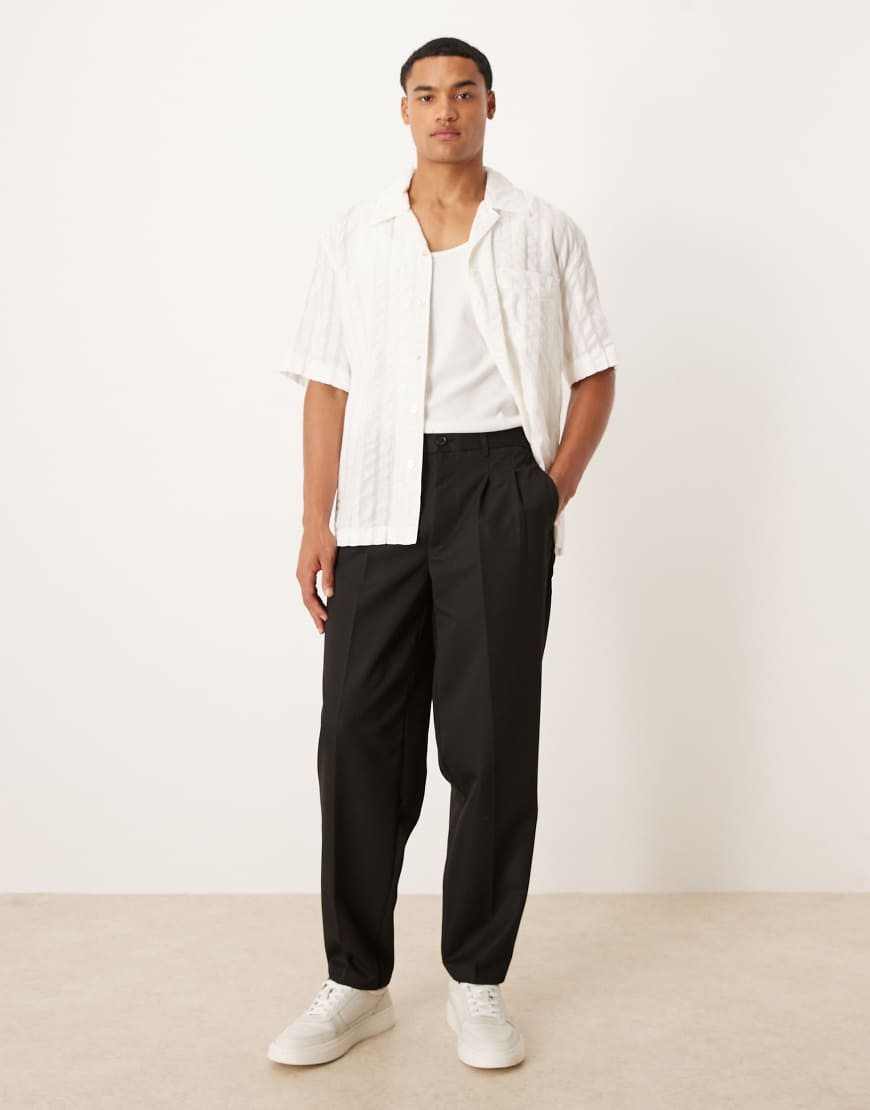 Oversized tapered pants with double pleat in black
