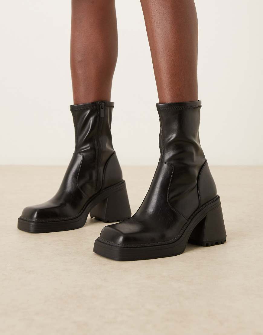 Reign square toe mid-heel platform boots in black