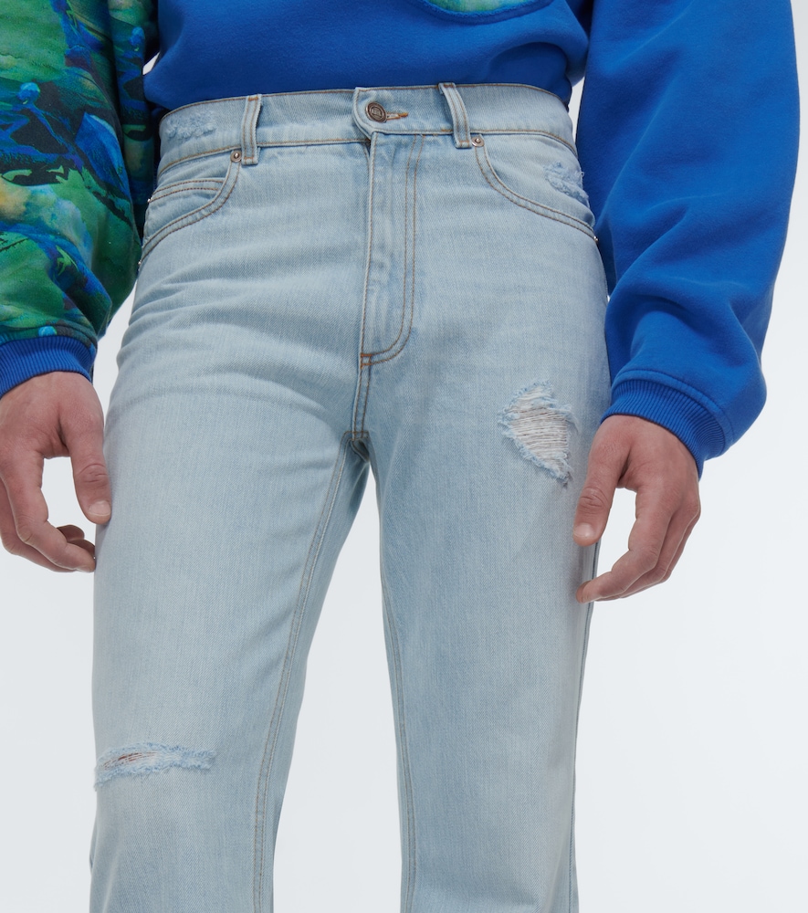 Distressed mid-rise flared jeans