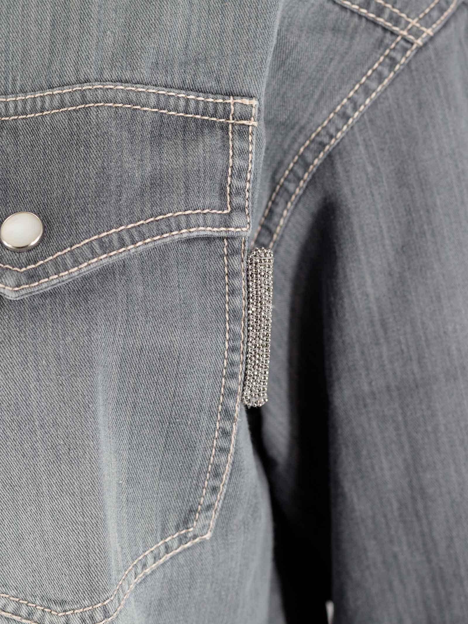 Distressed buttoned denim shirt
