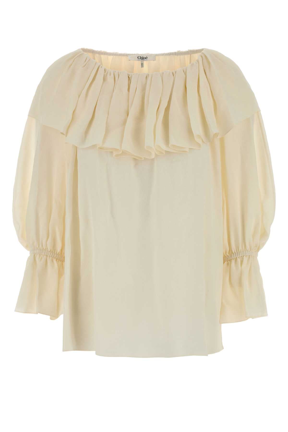 Ruffled Off-Shoulder Silk Blouse — Cream