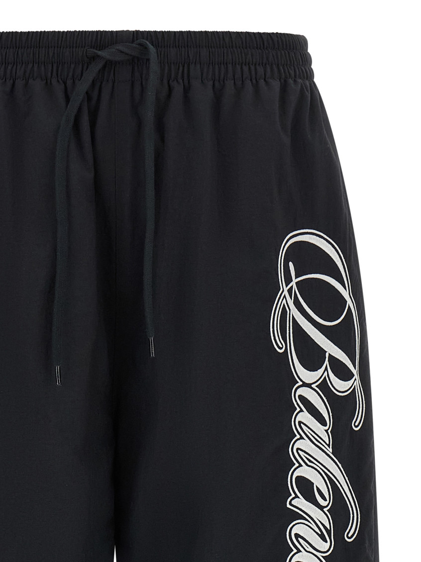 Balenciaga - reversible trousers featuring cursive motif design
