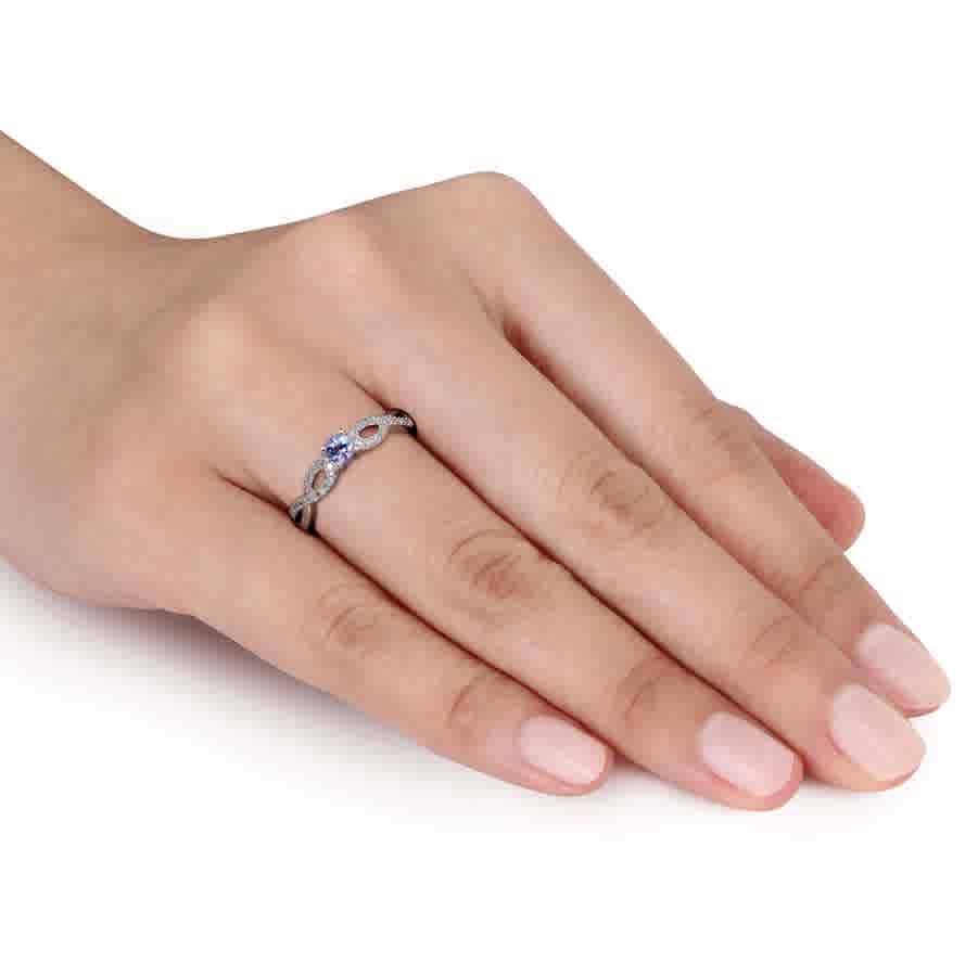 1/10 CT TW Diamond and Tanzanite Infinity Ring In Sterling Silver