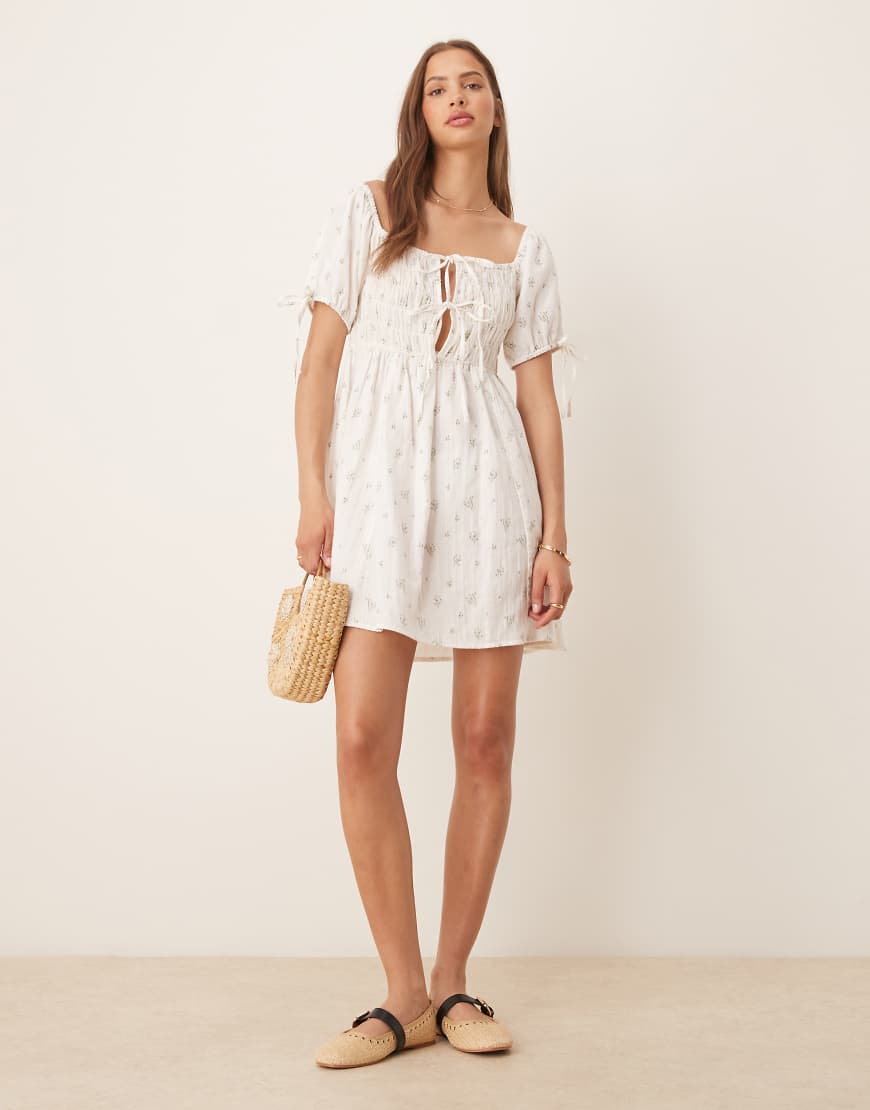 Esmee Exclusive tie front puff sleeve mini beach dress in white ditsy floral