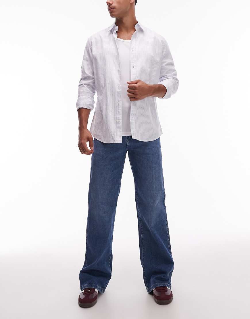 Loose bootcut jean in midwash blue