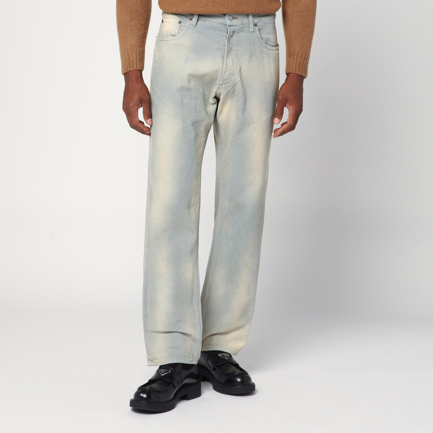 Light blue corduroy trousers with washed effect