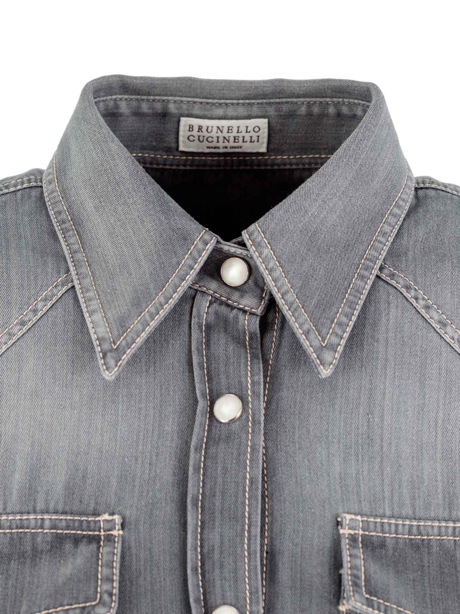 Distressed buttoned denim shirt