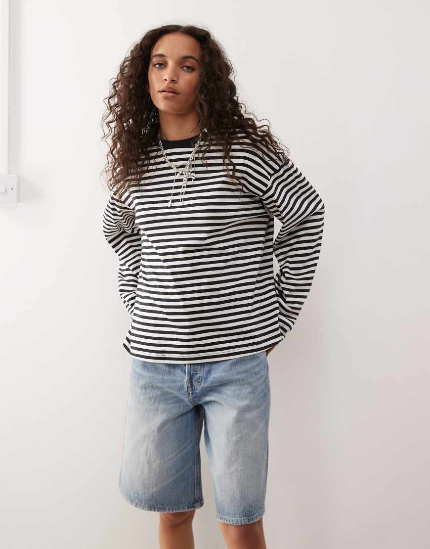 Oversized long sleeve t-shirt with side slits in black and white stripe