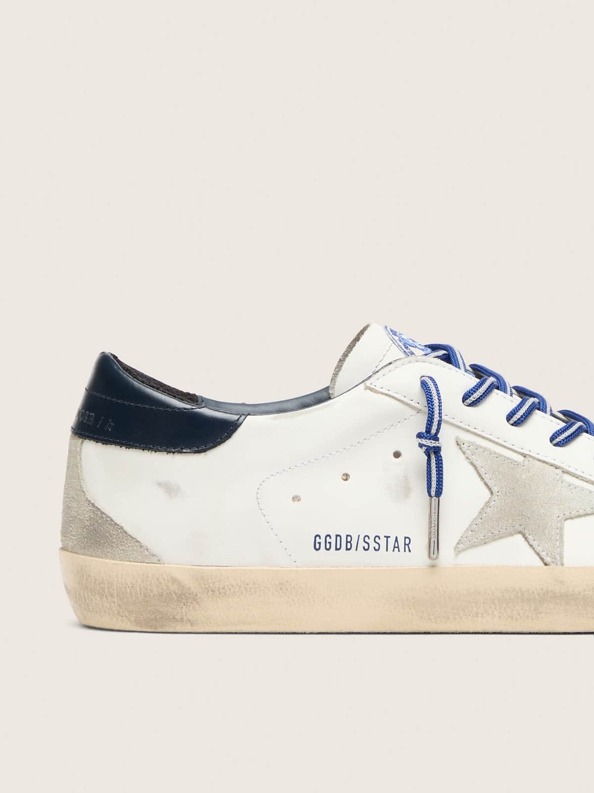 Golden Goose - Men's Super-star Ltd In White Leather With Suede Star And Blue Leather Heel Tab, Man