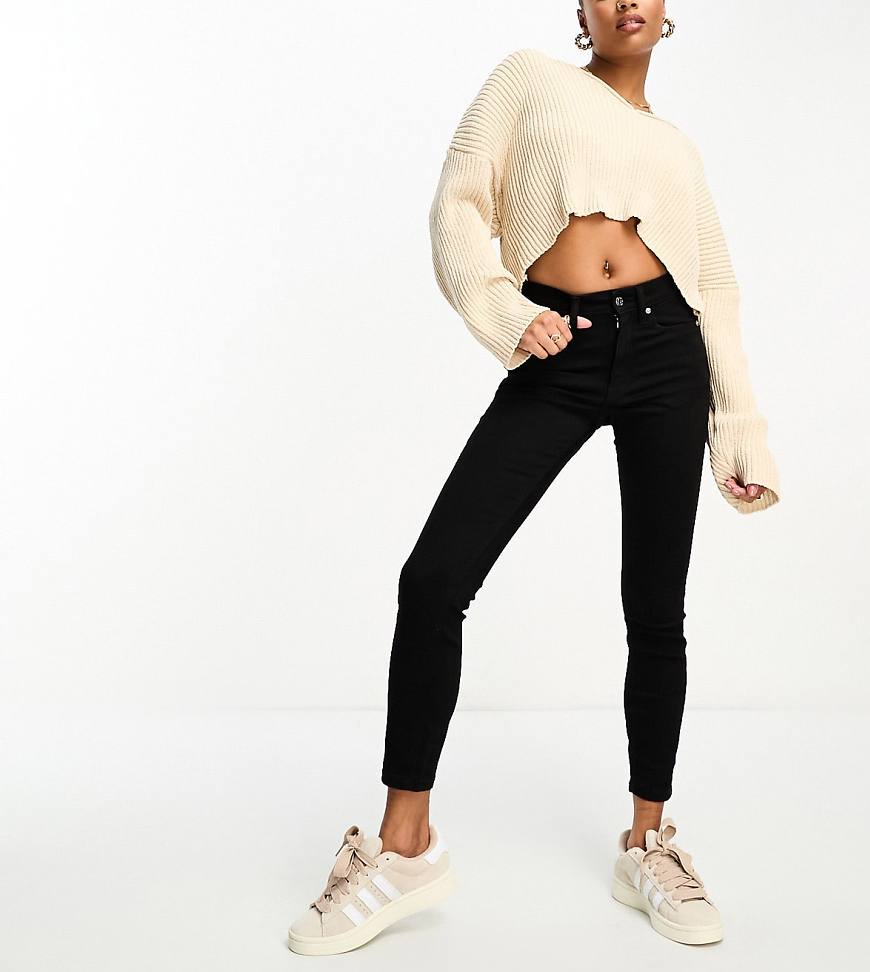 ASOS DESIGN Petite skinny jeans in black