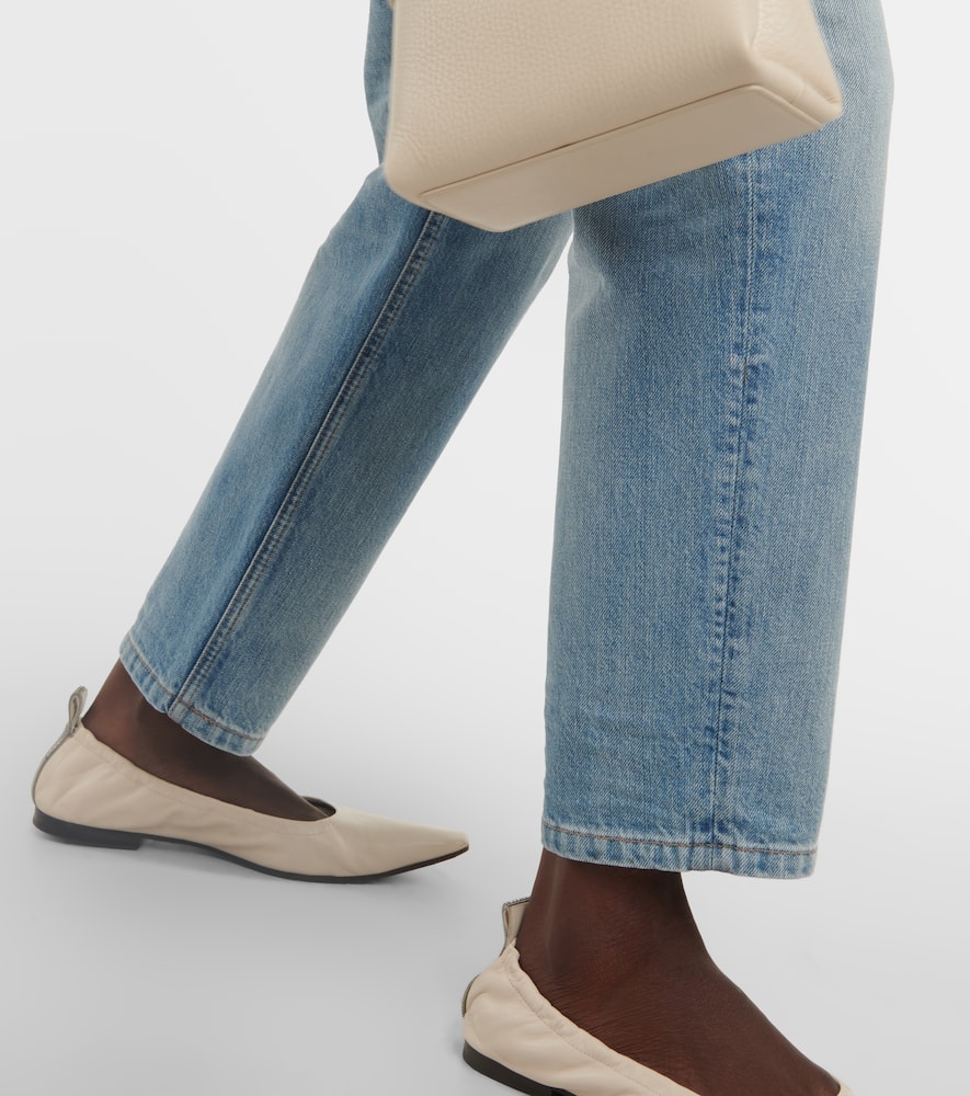 Mid-rise faded tapered jeans